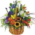 A colourful flower arrangement in a dish/in a basket...
