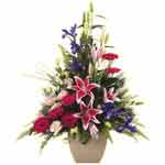 A stylish classic flower arrangement delivered in a pot could be a great gift to...
