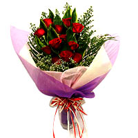 A beautiful bouquet of red roses with long accessory. This bouquet of premium re...