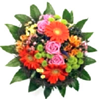 A bouquet of orange gerberas, pink roses and green various accessories....