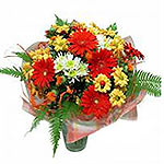 This wonderful bouquet is filled with bright yellow and red flowers. It is so ch...