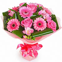 An amazing bouquet of pink gerberas and roses with greenary. A bouquet, which wi...