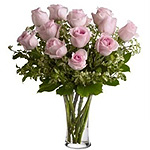 Charming 12 Pink Roses with Foliage in a Glass Vase