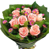 Artistic Arrangement of 9 Pink Roses with Tiny Purple Flowers