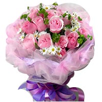 Classical bouquet of 19 pink roses and green leaves...