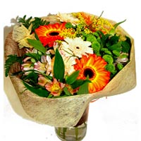 Bouquet of Gerberas, Minigerberas and Chrysantemums wrapped in fabric....