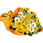 Bouquet of yellow lilies and mixed flowers ...