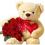 Roses with a big teddy bear...