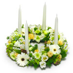 A New Year table arrangement in white and green, made with flowers like chrysant...