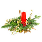This flat New Year table decoration set on a base of winter greenery is centred ...