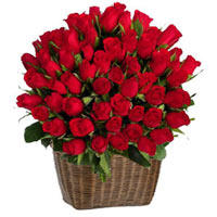 Our arrangement of one hundred red roses grown from a lovely basket, can burn th...