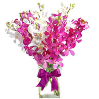 This lovely and finely arranged bouquet of white and purple will turn any day in...