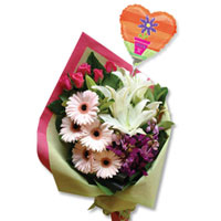 Moms Favorite colors are arranged in one bouquet with Best Mom stick balloon. An...
