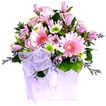Pretty mauve and pink flowers arranged into a gorgeous heart printed flower box....