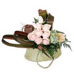 An interesting New Zealand Kete flax bag containing roses, succulents, flax, NZ ...