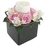 Very very special flower arrangements containing luxury candles. The white candl...
