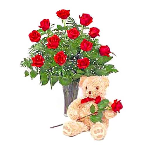 1 dozen red roses in a vase with bear...