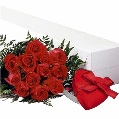 One dozen red roses in a bouquet with heart shape chocolates....