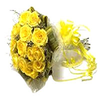 Bouquet of 13 yellow roses in a beautiful sea of green. Inspired by hot summers...
