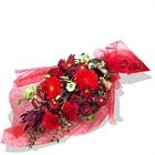  Holiday chrysanthemums, carnations, and hypericums have never looked so good in...