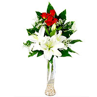 Flute transparent white lilies and red roses in a vase. 5 Red roses with 2 lilie...