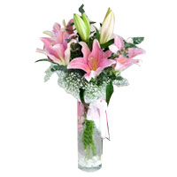 Spring Fairy Pink Lilies. In this bouquet 2 lilies are arranged with foliage....