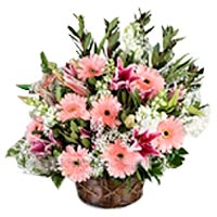 In this basket our florist beautifully arranged gerberas and other flowers...