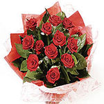 This graceful bouquet is composed of Red Roses with green blossoms. Its nicely w...