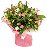 This Pink Candy bouquet is made of tulips, fressia and alstromeriya it is nestle...