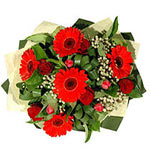 A wonderfull bouquet of roses,daizies,zerberas and greens.The perfect gift for a...