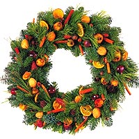 Wreath of fir, pine and native fruits. Orange slices and cinnamon give the fragr...