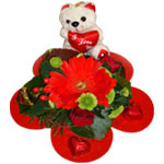 Cheer up a friend with this delightful arrangement  of red flower, chocolates an...