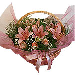A Luxurious display of scentd lilies, pink roses and foliage is as pretty as a p...