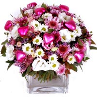 Small and intimate Bouquet  consisting of of the season flowers woven crowded an...