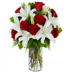 White Lilies & Red Roses in vase is a blushing dis...