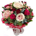 This exquisite hand-tied bouquet includes a variet...