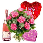 A bottle of soft wine of fruit, 12 fresh premium roses bouquet, a box of chocola...
