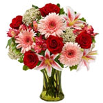 Surprise with this elegant arrangement of roses , lilies , gerberas and more in ...