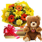 This spring bouquet is made of mix flowers. This bouquet is with Teddy bear and ...