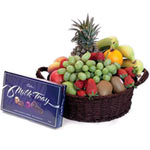 This striking fruit basket contains charming pinea...