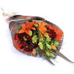 A delightful orange and red sheaf bouquet composed of charming lilies, chrysanth...