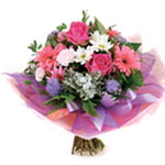 This striking pink and white bouquet composes pretty gerberas, roses, ageratum, ...