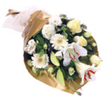 This fascinating white bouquet composes charming lilies, mini gerberas, roses, l...