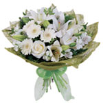 A fascinating white and cream bouquet including elegant gerberas, lilies, roses,...