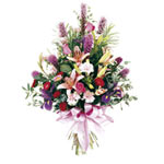 This adorable purple and pink sheaf includes fresh liatris, roses, carnations, l...