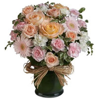 Stunning Composition of Seasonal Flowers in Raffia Lined Vase