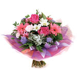 This striking pink and white bouquet composes pret......  to Logan