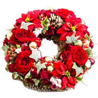 A beautiful New Year wreath with red roses will create a festive mood....