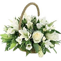 Beautiful fresh flowers arranged in floral foam in a basket....