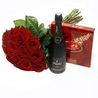 A beautiful gift for someone special - a dozen of  red roses, luxury box of choc...